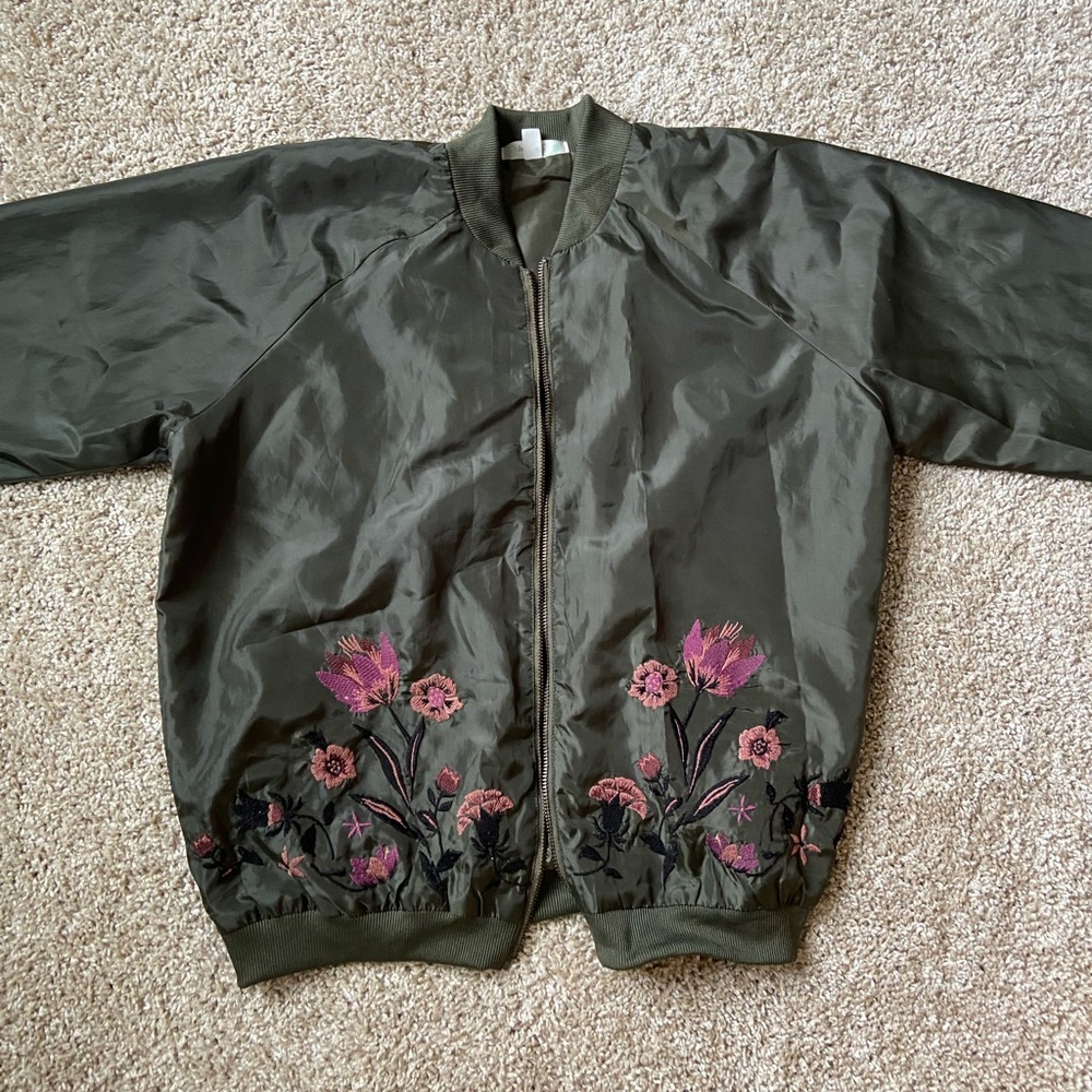 Green bomber jacket with floral embroidery